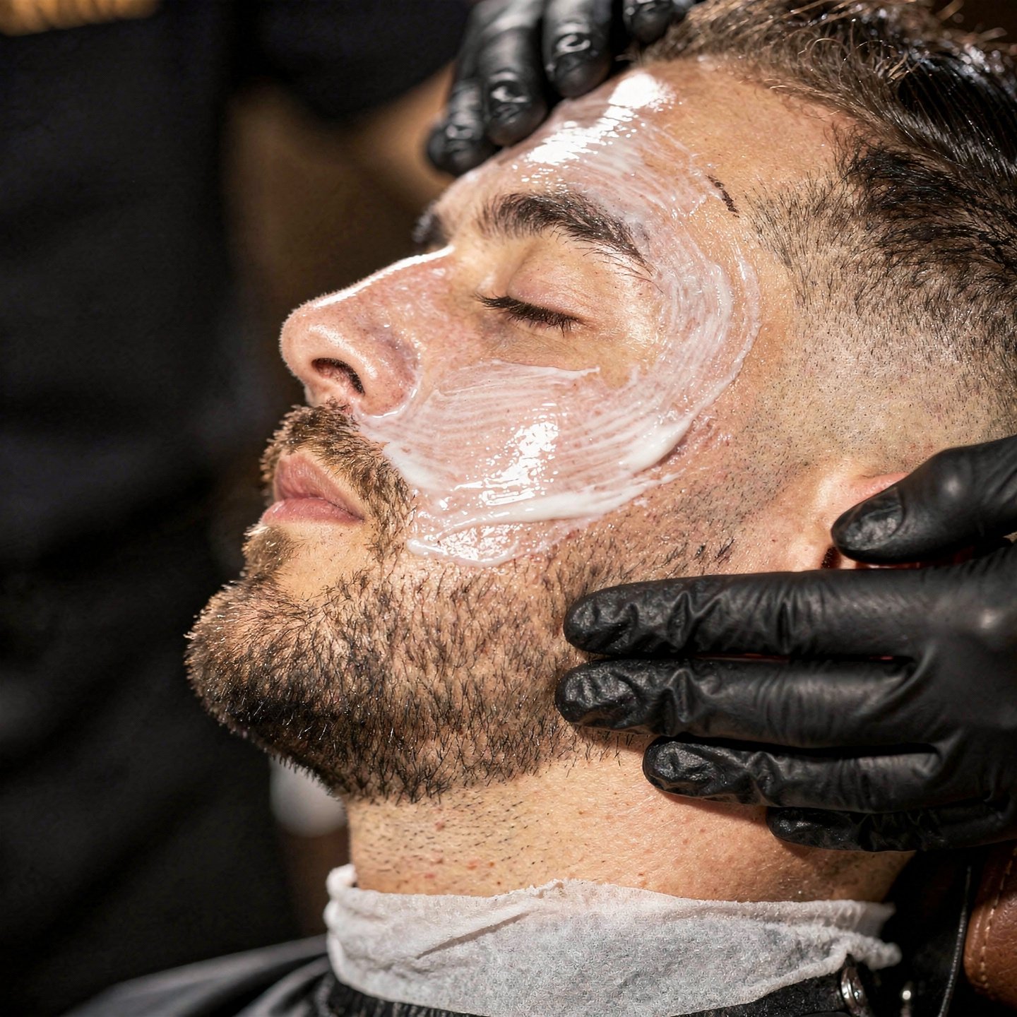 flux pro 2.0 extreme close up of a barber applying a facial treatment to a client focus on sk 0