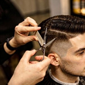 flux pro 2.0 extreme close up of a barber cutting a client’s hair with scissors and comb fo 0